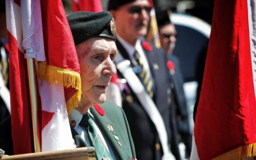 Korean War veteran Larry Lagacé (left), 80, stands at attention after taking part in the Annual Decoration Day Service Parade, which this year also commemorated the 60th Anniversary of the ceasefire in Korea. Larry enlisted in 1952 and served in the engineering core of the army as a Master Warrant Officer.  130505 May 05, 2013 Mike Deal / Winnipeg Free Press