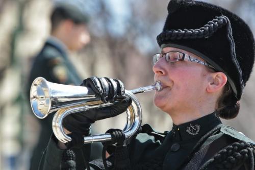 Master Corporal Irene Sas with the Royal Winnipeg Rifles plays the bugle during the ceremonies at the Memorial Boulevard Cenotaph after the Annual Decoration Day Service Parade, which this year also commemorated the 60th Anniversary of the ceasefire in Korea. 130505 May 05, 2013 Mike Deal / Winnipeg Free Press