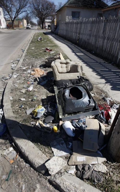 garbaged dumped on city boulevard near Parr  St. and Selkirk Ave City of Winnipeg is cracking down on illegal dumping of garbage  with tougher new fines  , also reducing the number of derelict properties by one third .bart kives story  KEN GIGLIOTTI / May 6  2013 / WINNIPEG FREE PRESS