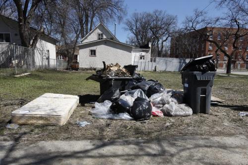 Garbage in backlane of empty lot on Manitoba Ave  - City of Winnipeg is cracking down on illegal dumping of garbage  with tougher new fines  , also reducing the number of derelict properties by one third .bart kives story  KEN GIGLIOTTI / May 6  2013 / WINNIPEG FREE PRESS