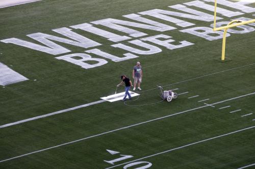 Stdup - LtoR Collin Kitching  paints goal line with Simon Mallion  - With Video - Winnipeg Blue Bomber's Investors Group Stadium gets lines painted on the field in preparation for the 2013 season Äì all the  yard lines , hashmarks  and numbers  are almost done with the goal lines , end zones  and advertizement  spaces are being finished with second coats of paint.  KEN GIGLIOTTI / May 7  2013 / WINNIPEG FREE PRESS