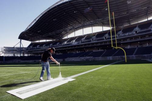 Stdup -  Collin Kitching  paints goaline - With Video - Winnipeg Blue Bomber's Investors Group Stadium gets lines painted on the field in preparation for the 2013 season Äì all the  yard lines , hashmarks  and numbers  are almost done with the goal lines , end zones  and advertizement  spaces are being finished with second coats of paint.  KEN GIGLIOTTI / May 7  2013 / WINNIPEG FREE PRESS