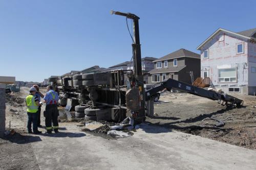 Belltower Drive. A delivery truck flipped over in the back lane. Leaking gas and oil. Haz Mat sceen hazmat. May 7, 2013  BORIS MINKEVICH / WINNIPEG FREE PRESS