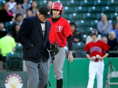 Fargo-Moorhead Redhawk #6 Zach Penprase debates the technical aspects of a strike with an un-interested umpire Hank Lemoine after being struck out Tuesday. See Melissa's story. May 7, 2013 - (Phil Hossack / Winnipeg Free Press)