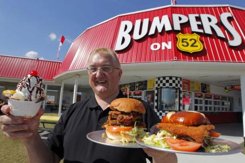 BUMPERS of 52 - Werner M. Klinger poses with some food from the Steinbach roadside restaurant. He is the manager there. May 7, 2013  BORIS MINKEVICH / WINNIPEG FREE PRESS