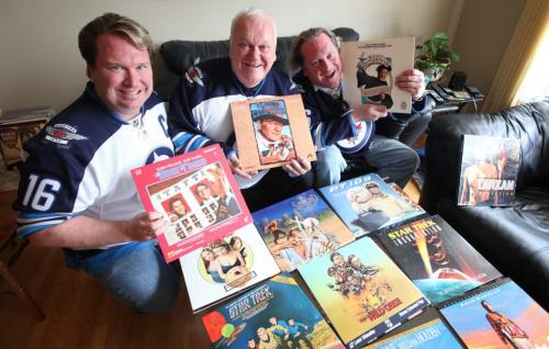Martin family enjoy collecting Laserdiscs, see Dave Sanderson column. Blaine Martin, his dad Byron (centre) and Brent Martin (right) hold some of their favorite discs.   .See Bart Kives Story.  Photography Ruth Bonneville Ruth Bonneville /  Winnipeg Free Press)