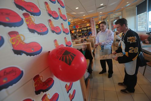 Brandon Sun Rick Dillabough and Quintin Lisoway greet patrons in the Richmond Avenue restaurant during McHappy Days in support of Westman Dream for Kids on Wednesday. (Bruce Bumstead/Brandon Sun)