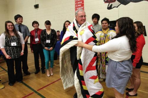 Students in the Martin Aboriginal Education Initiative class give former Prime Minister Paul Martin a star blanket during a school assembly at Major Pratt School in Russell, Manitoba, Wednesday afternoon.  130508 May 08, 2013 Mike Deal / Winnipeg Free Press