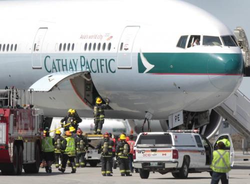 Winnipeg Fire Fighters check the cargo area of a Cathay Pacific plane heading from Hong Kong to Chicago after it was diverted to Winnipeg after an "indicator light" came on alerting the flight crew to a possible fire. None was found. Ashley Prest  story  (WAYNE GLOWACKI/WINNIPEG FREE PRESS) Winnipeg Free Press May 9 2013