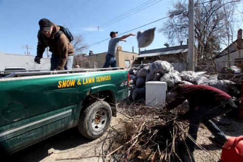 Sscope charitable organization provides support and employment opportunities to individuals dealing with mental health issues. Sscope crews are currently in the midst of spring cleanup activities throughout the city.    Crews members empty truck full of leaves, brush and supplies at depot on Arlington at the end of the work day.  May 09 2013. Photography Ruth Bonneville Winnipeg Free Press