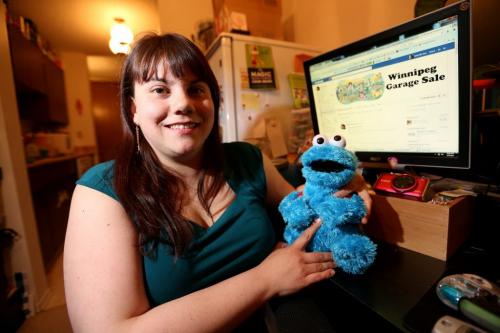 Michelle Roy with a Cookie Monster she picked up at a garage sale, and the Facebook page she started that now boasts over 900 members, Winnipeg Garage Sale, Thursday, May 9, 2013. (TREVOR HAGAN/WINNIPEG FREE PRESS)