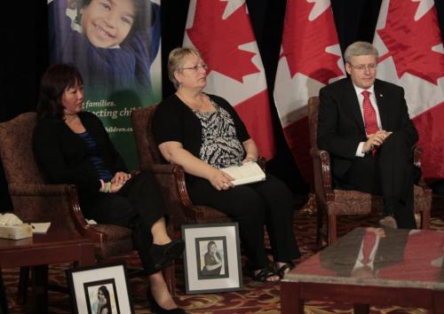 Prime Minister Stephen Harper attending a round table meeting on cyberbulling with family of victims of cyberbulling including left Pam Murchison with a portrait of Jenna Bowers-Bryanton and Carol Todd with a portrait of Amanda Todd held in the Delta Inn in Winnipeg Friday. Larry Kusch story Wayne Glowacki/Winnipeg Free Press May 10 2013