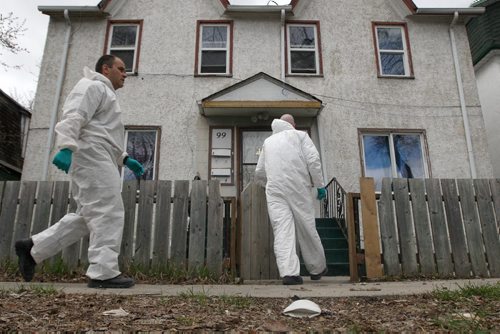 Winnipeg Police Service  forensic members outside a rooming house- late Friday afternoon in the 100 block of Lorne Ave where investigators found the remains of 36 year old Myrna Letandre- the death is now being treated as a homicide -See Mike McIntyre story- May 10, 2013   (JOE BRYKSA / WINNIPEG FREE PRESS)