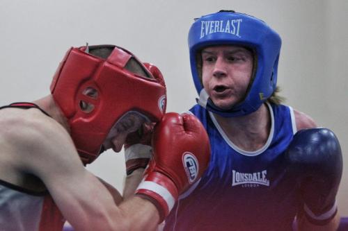 Adam Jacobsen in blue from the Pan Am Boxing Club fights Jack Wiebe in red from the YFC Morris Boxing Club in a bout during the 2013 Manitoba Amateur Boxing Provincials at the Broadway Community Centre Sunday. 130512 May 12, 2013 Mike Deal / Winnipeg Free Press