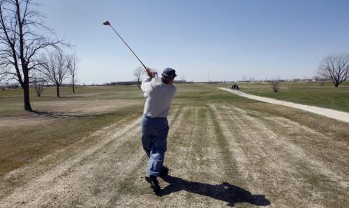 Golfer Frank Sclamacis tees off on a round of golf- City of Winnipeg is putting the John Blumberg Park  ,golf , softball and  soccer complex   up for sale -  KEN GIGLIOTTI / May 13  2013 / WINNIPEG FREE PRESS