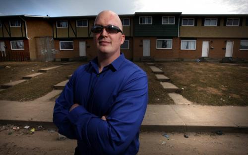 Prince Alber City Cop, Matt Gray poses in a low income neighborhood a location he often sees troubled youth and where the CMPA project often "knocks on doors"....See Randy Turner's story re: Prince Albert's "Community Mobilization", a crime prevention project started in Glasgow Scotland, now cutting crime statistics proactivley in the small prairie city. May 9, 2013 - (Phil Hossack / Winnipeg Free Press)