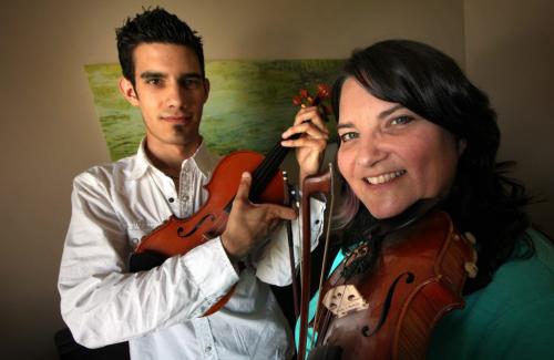 Patti Lamoureux and son Alex with their fiddles, Patti is leading the local staging of World Fiddle Day on Saturday May 18 at Coronation Park in St. Boniface where the local fiddling community of musicians and fans will  congregate at noon to celebrate fiddling and its music. Similar celebrations are being held around the world on the same day. May 14, 2013 - (Phil Hossack / Winnipeg Free Press)