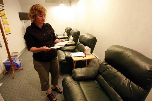 the clinic director Tammi Kromenaker reads notes written in journals provide to  abortion patients to write down their thoughts while resting in post procedures comfortable chairs  in the recovery area . Abortion Issue Feature Äì Red River Women's Clinic in Fargo North Dakota where new  laws are being considered to challenge  the current Pro Choice legislation currently in effect in North Dakota . Pictures  include tour  give by the clinic director Tammi Kromenaker  KEN GIGLIOTTI / May 16  2013 / WINNIPEG FREE PRESS