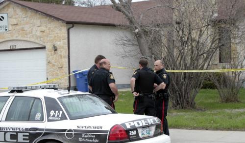 Winnipeg Police at a  home in the 4300 block of Roblin Blvd. Friday morning that is tapped off.Alex Paul story. (WAYNE GLOWACKI/WINNIPEG FREE PRESS) Winnipeg Free Press May 17 2013
