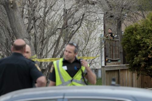 Winnipeg Police in front and on the back yard deck of a home in the 4300 block of Roblin Blvd. Friday morning that is tapped off.Alex Paul story. (WAYNE GLOWACKI/WINNIPEG FREE PRESS) Winnipeg Free Press May 17 2013