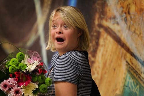 Lauren Potter, star of tv show "Glee"  in Winnipeg for national down syndrome conference, takes a moment for photographs with fans and press at the Delta Hotel Saturday morning as she holds flowers from one of her fans from the audience. May 18, 2013 Ruth Bonneville Winnipeg Free Press