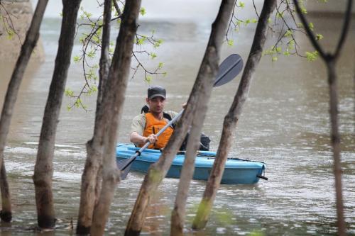 Ryan Chymy enjoys an afternoon kayaking down the Assiniboine River need the Forks Saturday afternoon.  This is the 1st time he's been on the water this year and says he doesn't mind the cool weather and rain after such a long, cold winter. Standup photo. May 18, 2013 Ruth Bonneville Winnipeg Free Press