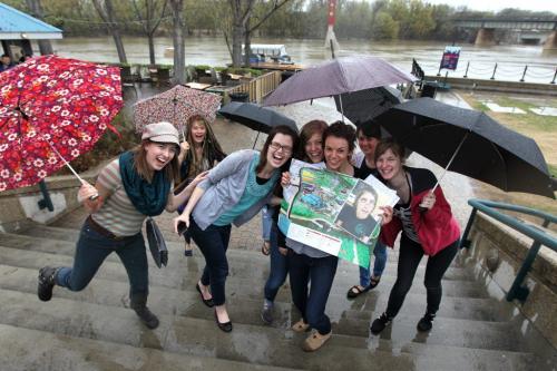 Bride to be Mindy Goodman laughs with her bridesmaids as they run up the steps from the river walk at the Forks  while on a scavenger hunt Saturday afternoon.   Goodman (centre, without umbrella) holds a map and a photo of her husband to be  - Levi Goetz  in her hand while on the hunt organized by her bridesmaids.   Standup photo May 18, 2013 Ruth Bonneville Winnipeg Free Press