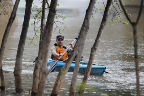 Ryan Chymy enjoys an afternoon kayaking down the Assiniboine River need the Forks Saturday afternoon.  This is the 1st time he's been on the water this year and says he doesn't mind the cool weather and rain after such a long, cold winter. Standup photo. May 18, 2013 Ruth Bonneville Winnipeg Free Press Winnipeg Free Press