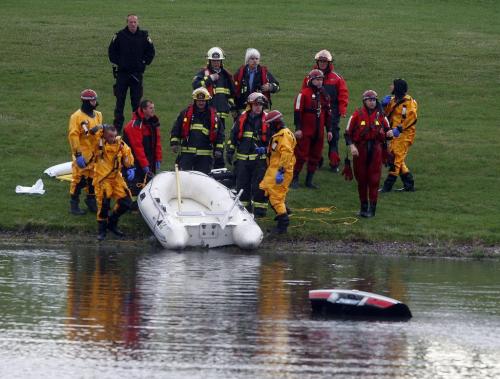 Wpg Fire take one body from a submerged car in a retention pond on Dalhousie Dr near Pembina , a red car with its trunk open is mostly submerged  KEN GIGLIOTTI / May 21  2013 / WINNIPEG FREE PRESS