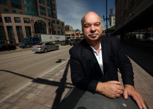 Peter Kaufmann poses on Portage ave Tuesday afternoon. He comments on how and where a new downtown grocery story might work in Geoff Kirbyson's story.  May 21, 2013 - (Phil Hossack / Winnipeg Free Press)