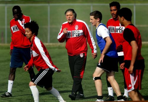 WSA coach Edwardo Badescu motivates his team Tuesday evening at a practice . Opening game is this coming weekend. See Tim Campbell's story. May 21, 2013 - (Phil Hossack / Winnipeg Free Press)