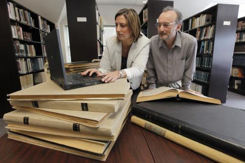 May 21, 2013 - 130521  -  Sophie Gaulin, editor-in-chief and executive director general of La Liberté and Gilles Lesage, director of the Societé Historique de Saint-Boniface go through some copies of La Liberté Tuesday, May 21, 2013. La Liberte is celebrating its 100th anniversary by putting its archives on line.  John Woods / Winnipeg Free Press