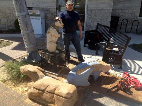 Dwayne Ball carves some animals on Sutherland in front of the Manitoba Indigenous Cultural Education Centre. The carvings were done by some other artists but he is refurbishing them and adding detail and finishing. May 22, 2013  BORIS MINKEVICH / WINNIPEG FREE PRESS