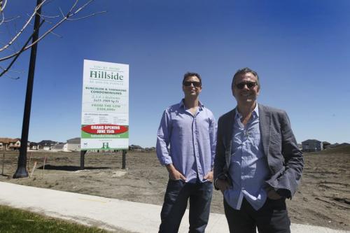 Marc Kipness (shorter) and Myles Kraut (left) with Karma Development next to new Hillside Condo property to be developed. See Story.  May 23, 2013 Ruth Bonneville Winnipeg Free Press
