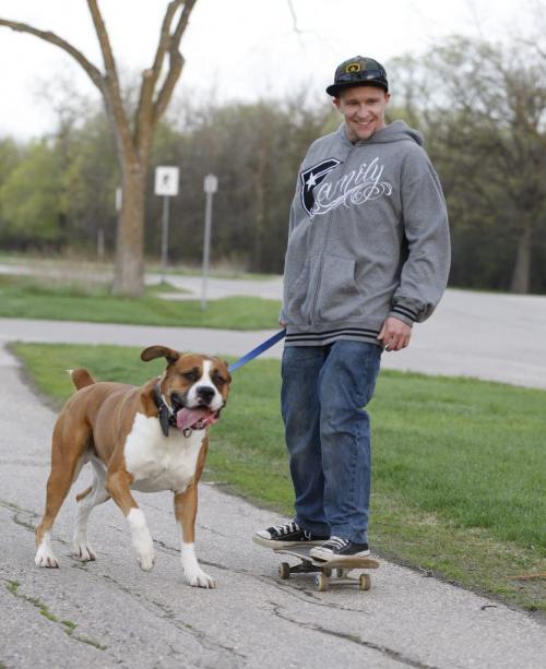 Stdup -Dustin Girard 's dog Cash is taking him for his morning run at Assiniboine Park before 7am KEN GIGLIOTTI / May 24  2013 / WINNIPEG FREE PRESS