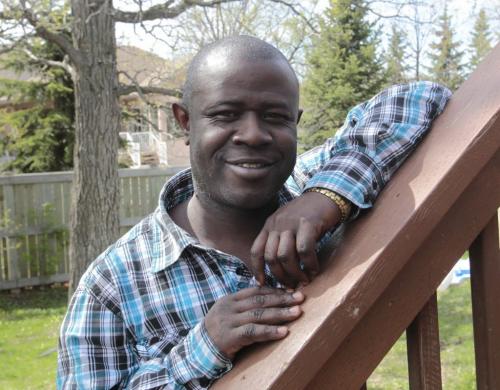 Adebola Ogunsanya at his home in Winnipeg, he came here from Nigeria, took disability studies at Red River while raising a family and holding down two fulltime and one part-time job. Canada wont recognize his MBA. Nick Martin story   (WAYNE GLOWACKI/WINNIPEG FREE PRESS) Winnipeg Free Press May 24 2013