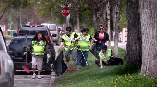 A group of women from the organization "Urban Circle" move along Manitoba ave Friday morning. They were among a hundred or so volunteers who gave their time to help clean up the north end neighborhood. One froup picked up 8 mattresses from one yard! See release. May 24, 2013 - (Phil Hossack / Winnipeg Free Press)