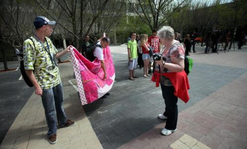 A home made quilt is held up for inspection as about 150 of the faithfull showed up at city hall Friday over the lunch hour to listen to the mayor and others proclaim the opening of Gay Pride Week, and raise the rainbow flag. See Lindor's story. May 24, 2013 - (Phil Hossack / Winnipeg Free Press)
