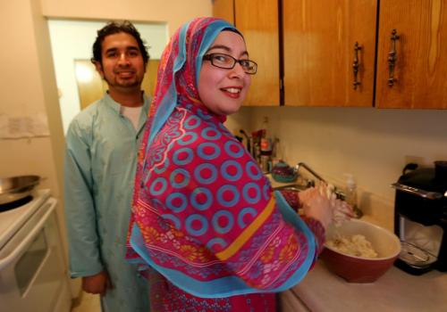 Mohammad Haider and Lubna Usmani making Gulab Jamun for Islamic Culture Day which takes place Sunday at the Grand Mosque, Friday, May 24, 2013. The dish is similar to a timbit, and is served soaked in a syrup. (TREVOR HAGAN/WINNIPEG FREE PRESS)