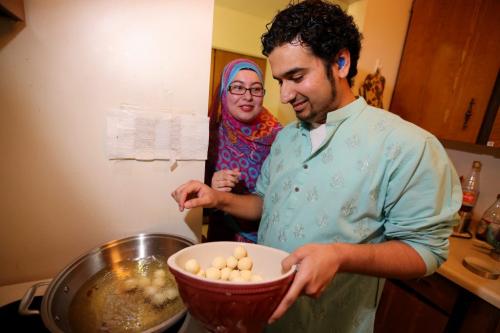 Lubna Usmani and Mohammad Haider making Gulab Jamun for Islamic Culture Day which takes place Sunday at the Grand Mosque, Friday, May 24, 2013. The dish is similar to a timbit, and is served soaked in a syrup. (TREVOR HAGAN/WINNIPEG FREE PRESS)