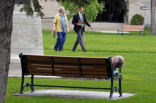 A man naps on a park bench at the Leg. May 27, 2013  BORIS MINKEVICH / WINNIPEG FREE PRESS