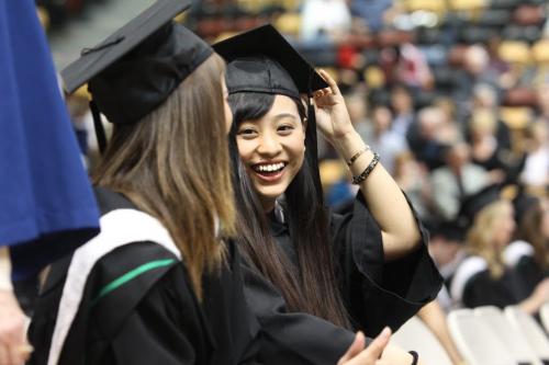 U of M Bachelor of Arts students show their excitement during the Grad 134th annual convocation ceremony at the Investors Group Athletic Centre Tuesday.Xuan Quin (right) smiles at her friend and fellow graduate Janelle Ptashnick after receiving degree. Standup photo  May 28, 2013 Ruth Bonneville Winnipeg Free Press