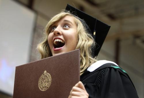 U of M Bachelor of Arts students show their excitement during the Grad 134th annual convocation ceremony at the Investors Group Athletic Centre Tuesday.  Lena Pitsanuk shows her excitement to friends and family after receiving her degree Tuesday. Standup photo  May 28, 2013 Ruth Bonneville Winnipeg Free Press