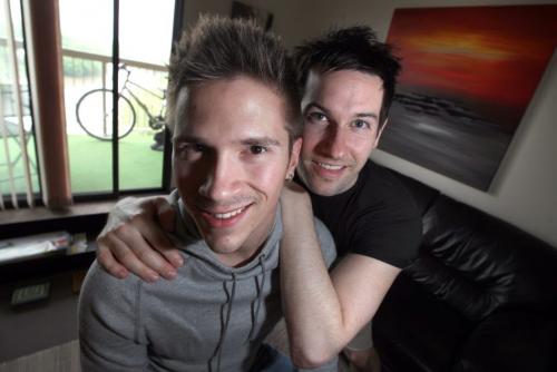 Scott Andrew and Bryce Weedmark (left) pose in their apartment Tuesday. Bryce very publicly proposed to Scott Saturday night at a concert. He'd peppered the audience with friends and family. See Lindor Reynolds story. May 28, 2013  -  (Phil Hossack / Winnipeg Free Press_