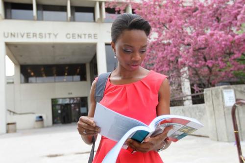 University of Manitoba campus life. Emem Ukpong in the faculty of Social Work, reads outside University Centre Wednesday afternoon.   May 29, 2013 Ruth Bonneville Winnipeg Free Press