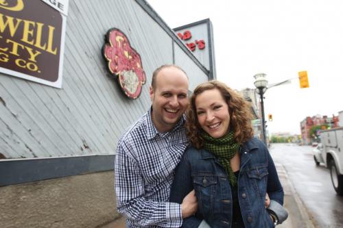The Grove Restaurant owners Miles and Danielle Gould  pose for a photo outside the old Papa George's Restaurant on the corner of River and Osborne Wednesday afternoon just before press conference announcing the opening of a second restaurant by the couple within the year.  The new restaurant slated to open in October this year  will be a different name and concept from The Grove but will have the same owners and head chef Norman Pastorin.  May 30, 2013 Ruth Bonneville Winnipeg Free Press