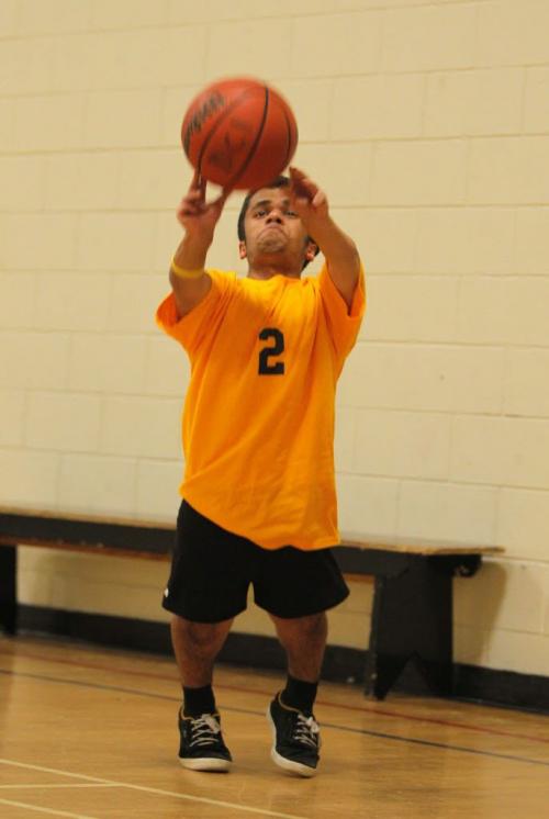 Vivek Bhagria shoots hoops in the Dakota Collegiate gym. He is an 18-year-old grade 12 student who lives with dwarfism and will represent Manitoba and Canada at the 2013 World Dwarf Games on Aug. 3-10, 2013 at Michigan State University, East Lansing Michigan. He will compete in soccer, track, basketball, volleyball, boccia and badminton. He was the Dakota Collegiate athlete of the month for April as he led the school's Ultimate team in assists and points. For Ashley's story in Sat. paper. His coach Brad Johnston will be there. May 31, 2013  BORIS MINKEVICH / WINNIPEG FREE PRESS