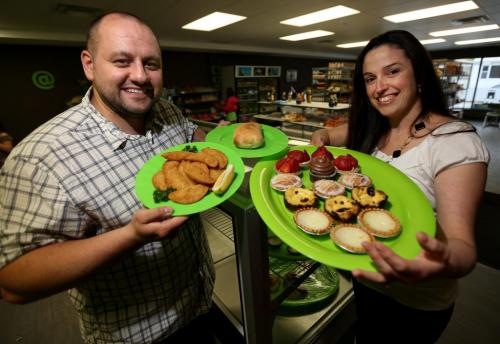 Luis Esteves and Ana Godinho Esteves at Viena Do Castelo on Sargent Avenue with Rissois, a Chourico in a bun and assorted pastries, Friday, May 31, 2013. (TREVOR HAGAN/WINNIPEG FREE PRESS)