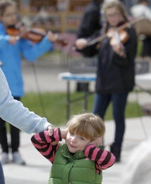 A young fiddle fan at the St. Norbert Farmers Market on its opening day of the season, 2013. (TREVOR HAGAN/WINNIPEG FREE PRESS)