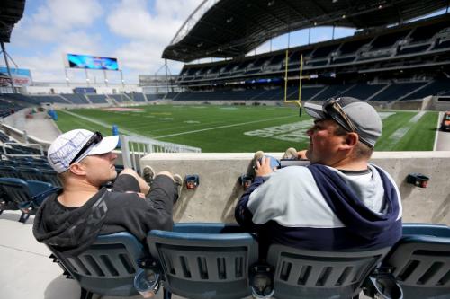 New season ticket holders, Jeff Krampetz and Mike Boyle, checking out some pretty good seats at Investors Group Field after picking up their tickets, Saturday, June 1, 2013. (TREVOR HAGAN/WINNIPEG FREE PRESS)